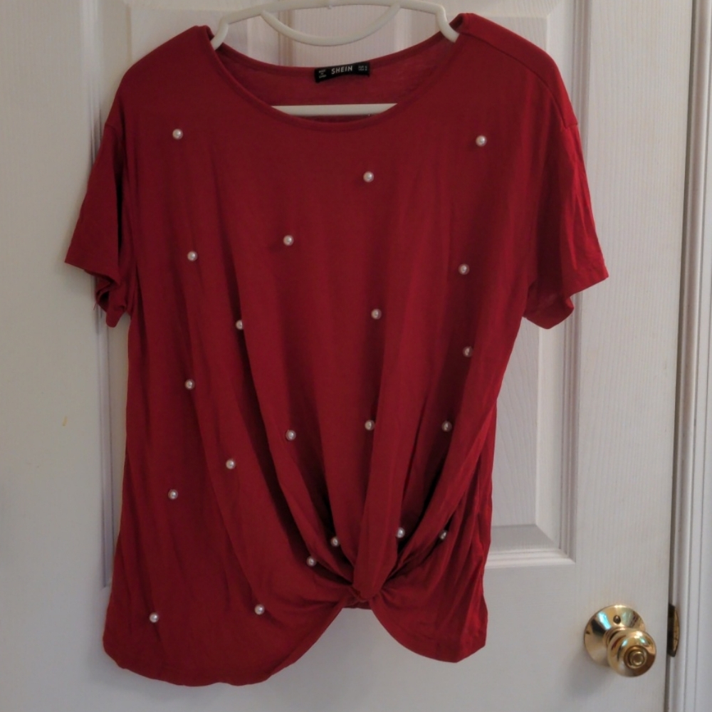 Red gathered top with faux pearl embellishments